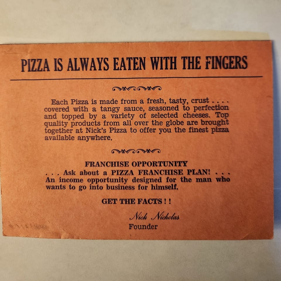 An orange flyer for Nick's Pizza, advertising pizza and franchise opportunities.